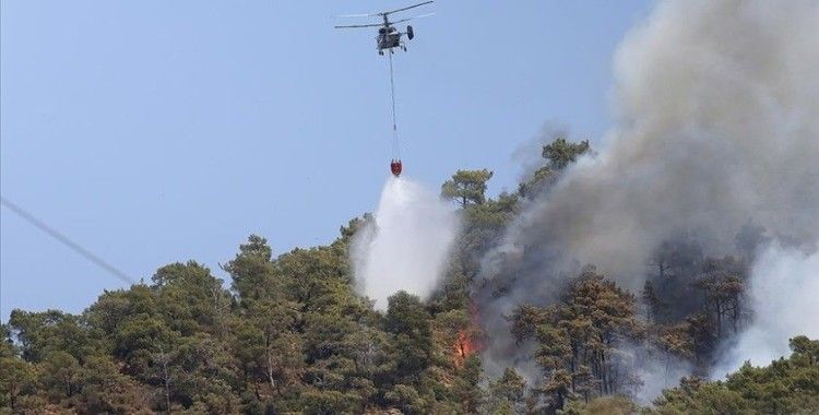 Marmaris'in Turunç ve Hisarönü Mahallelerinde ormanlık alanına sıçrayan yangına müdahale ediliyor