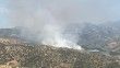 İzmir'de makilik alanda çıkan yangına müdahale ediliyor