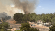 Antalya'da yerleşim yerine yakın ağaçlık alanda yangın çıktı